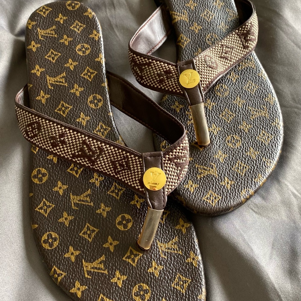 Louis Vuitton flip flops.